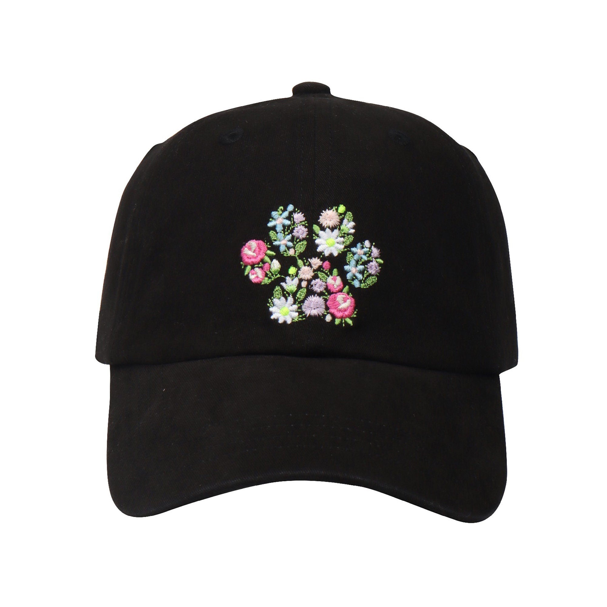 May include: A black baseball cap with a floral embroidery design on the front. The embroidery features pink, blue, and white flowers.