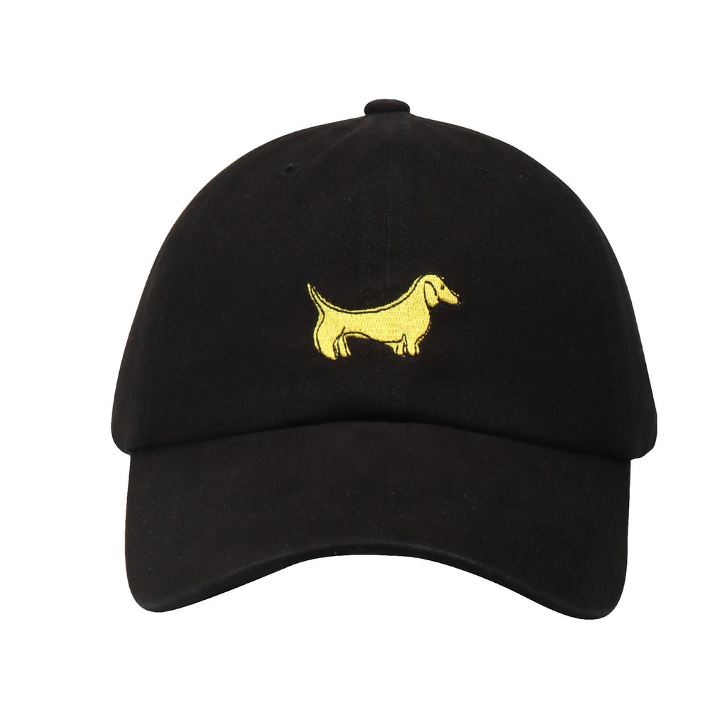 May include: A black baseball cap with a yellow embroidered dachshund on the front